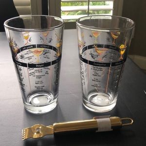 Two drink mixing glasses and a zester